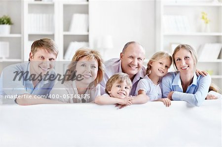 Happy family with children and grandchildren on the couch