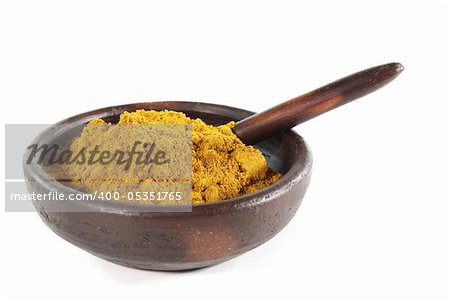 yellow, spicy curry mixture in a brown bowl