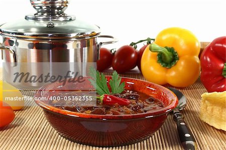 Chili con carne with kidney beans, beef, peppers and parsley