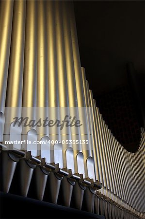 An organ in the church - close-up organ pipes - side view