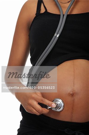 Pregnant woman listening her belly with stethoscope , isolated on white background