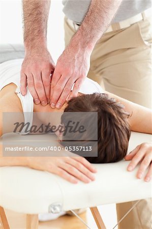 Woman getting a neck-massage in a room