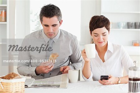 A lovely couple is having breakfast together