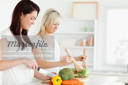 Women preparing dinner in a kitchen