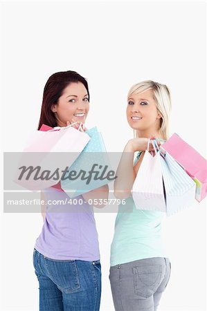 Young women with shopping bags in a studio