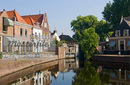 The old 16th century (1571) village of Spaarndam, the Netherlands, with the old inner harbour, it's sluices and locks, the fishermans' houses, currently a quaint town with a terrace, bikes and a very quiet atmosphere