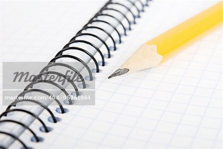 Education and objects. Blank notebook with pencil