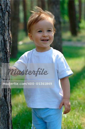 Close-up portrait of a smiling baby at the park