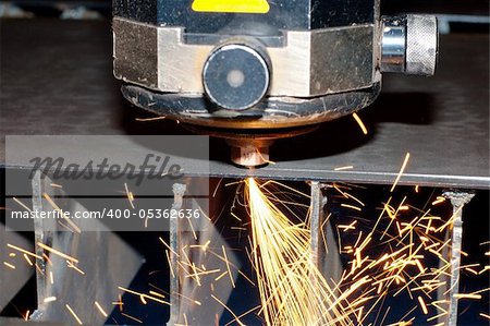 Industrial laser with sparks flying around