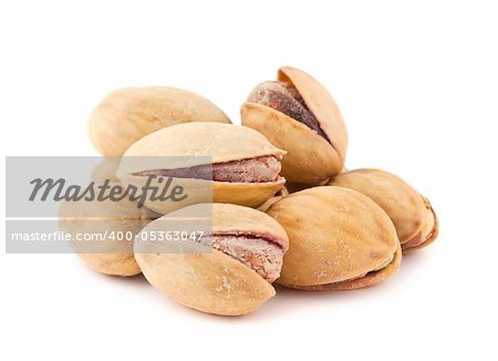 toasted pistachios isolated on a white background