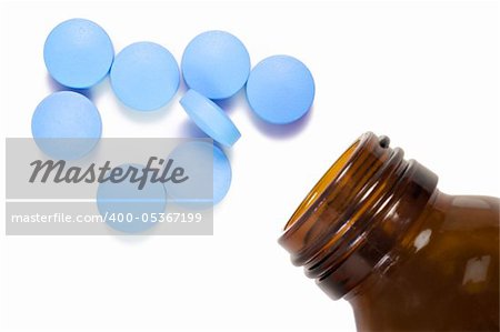 Pill and pill bottle on white background with space for text