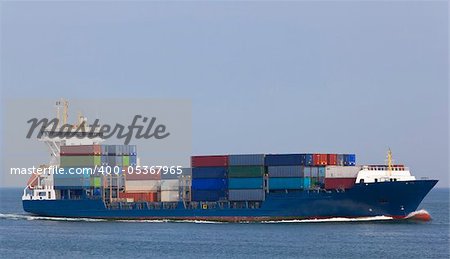 container ship entering the harbour of rotterdam