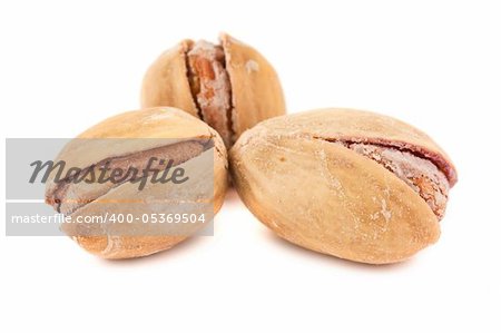 Toasted pistachios isolated on a white background