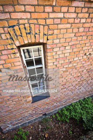 A window surrounded by bricks near Pampas Marine, Sweden