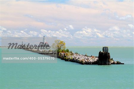 lighthouse in blue water in chicago on lake michigan in the fall