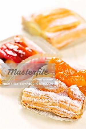 Closeup on slices of flaky fruit strudel desserts