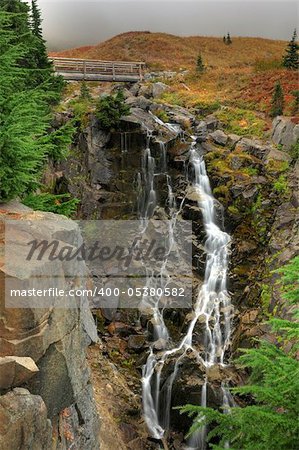 Beautiful Myrtle falls at Mt Rainier National Park in a foggy day of autumn