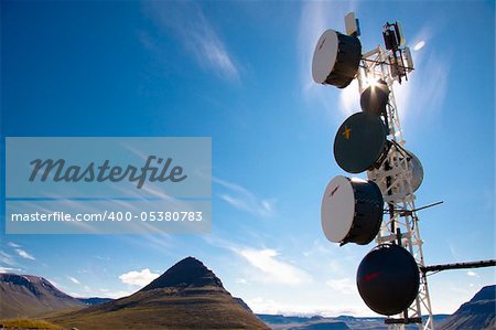 Iceland - cell antenas blue sky white clouds and sunlight