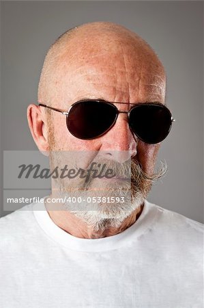 An old man with a grey beard sunglasses