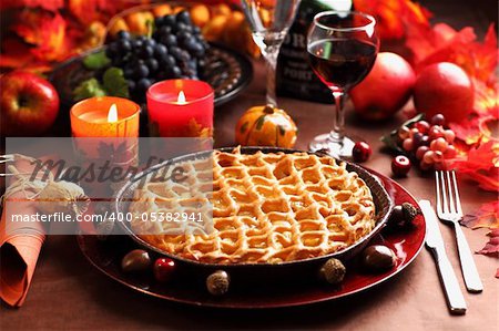 Apple pie for Thanksgiving with wine and grapes