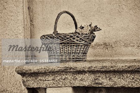 wicker basket on a bench, black and white filter