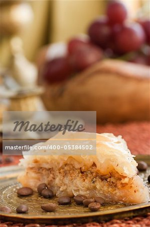 Delicious baklava dessert in oriental golden setting