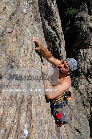 Male rock-climber  on a granite wall