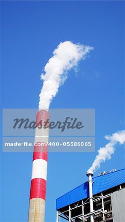 High chimney with steam in a heat power plant