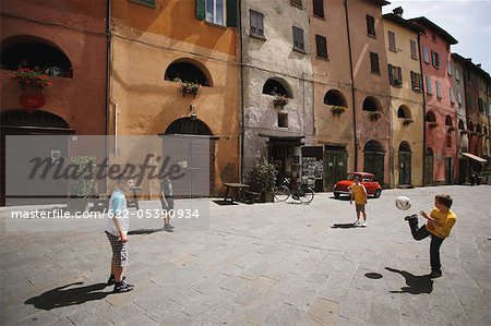 Children Playing Soccer In Street