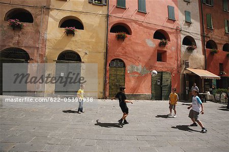 Children Playing Soccer In Street