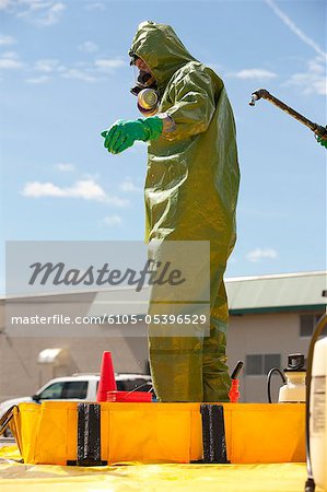 HazMat firefighter getting decontamination wash