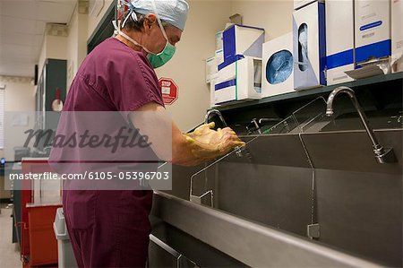 Ophthalmologist washing hands before cataract surgery