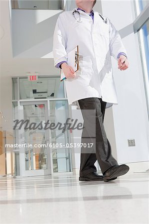 Male doctor walking in a corridor of a hospital