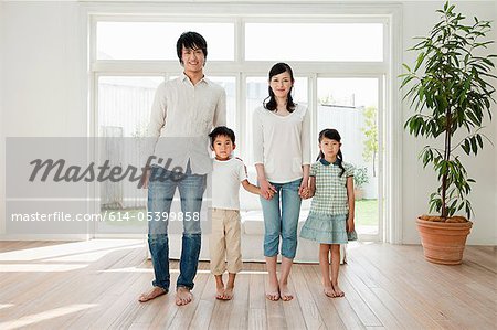 Family with two children at home, portrait