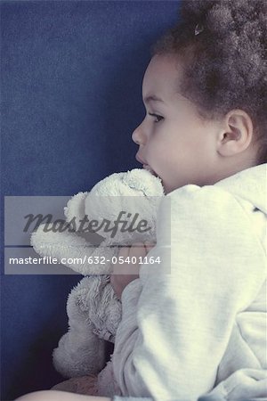 Little girl with stuffed toy