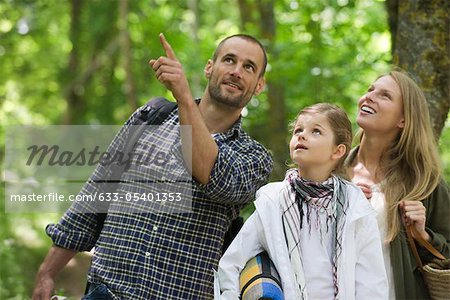 Family together outdoors, looking up in awe