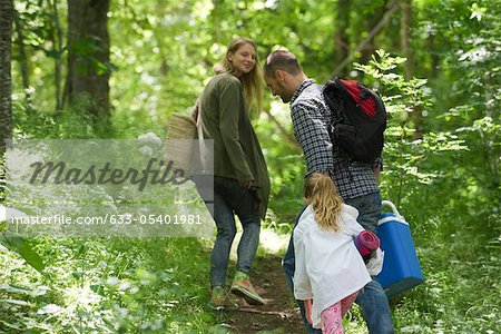 Family hiking in woods