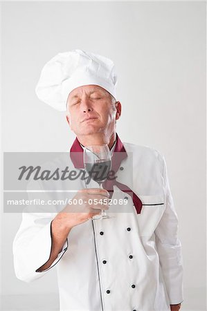 Chef Smelling Red Wine