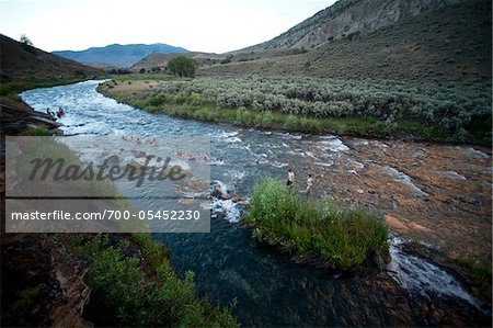 People Swimming in River, Yellowstone National Park, Wyoming, USA