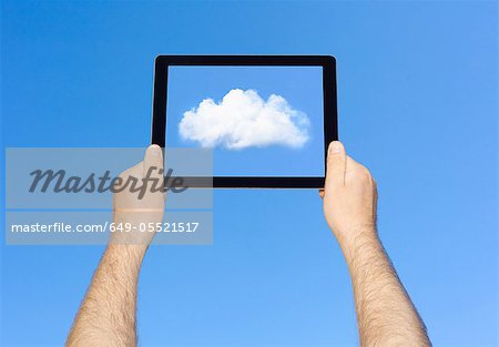 Man viewing cloud on tablet computer