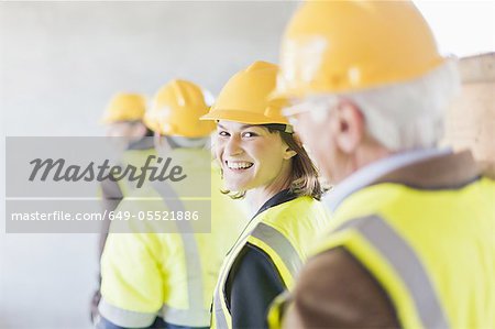 Construction worker smiling on site