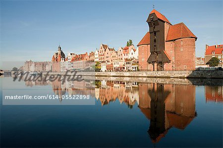 Medieval buildings reflected in water, Gdansk, Poland