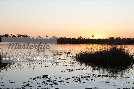 Sunset on the water in the Okavango Delta, Botswana, Africa