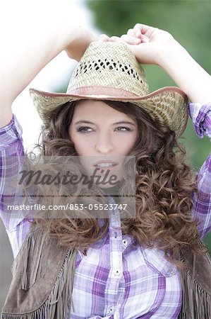 Young woman as cowgirl