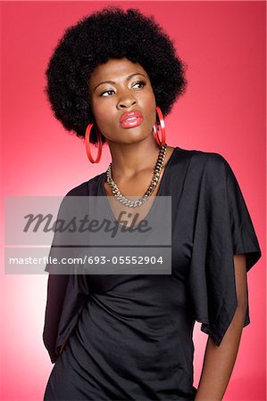 Trendy young African American woman over colored background