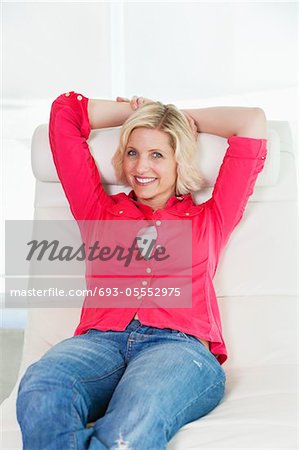 Front view of woman relaxing on deck chair