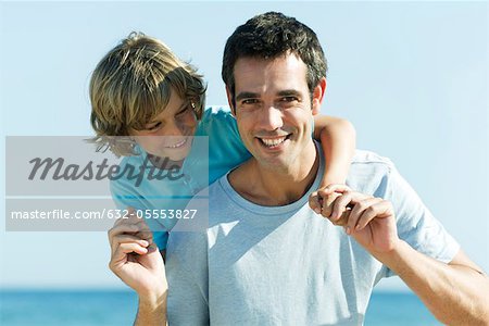 Father and son together outdoors, portrait