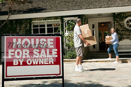 Mature couple moving into newly bought property