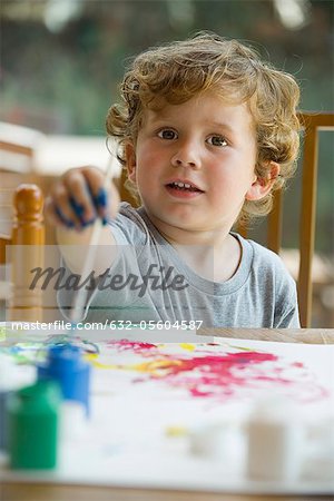 Little boy painting