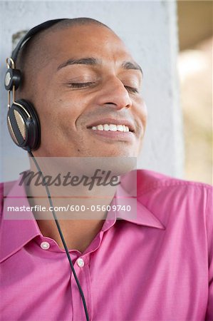 Close-up Portrait of Man using Headphones